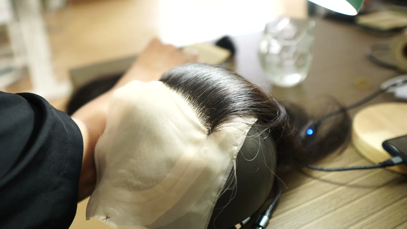 Finished Vietnamese human hair wig on a styling block